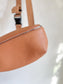 Monos: "Metro Sling Bag in Camel Brown"