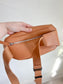 Monos: "Metro Sling Bag in Camel Brown"