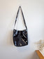 L’Intervalle Black Patent Crossbody Purse